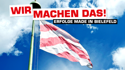 Foto von der Flagge der Bielefelder Sparrenburg. Auf dem Bild ist der Schriftzug "Wir machen das! - Erfolge made in Bielefeld"